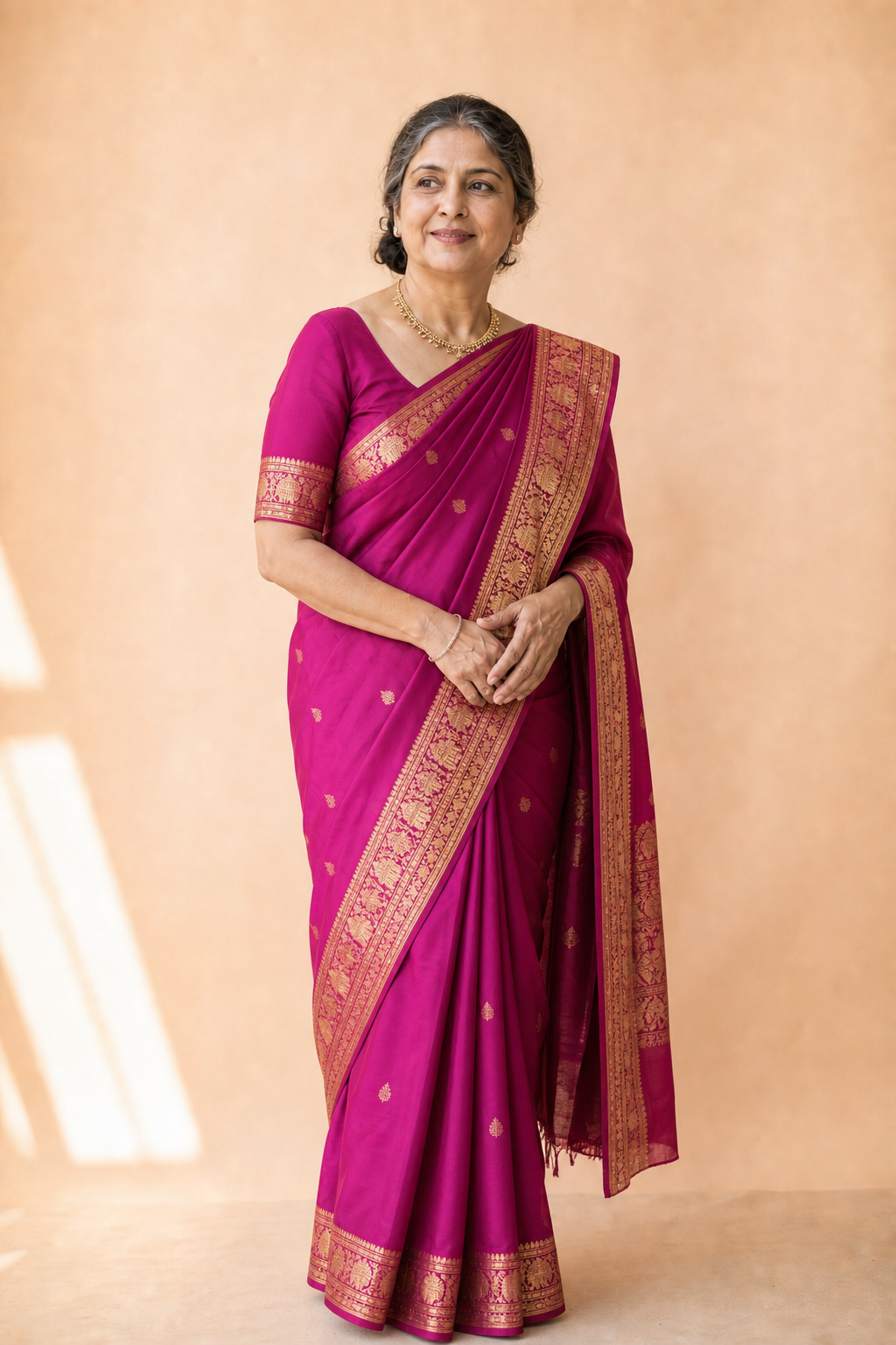 Mature woman in a magenta Kanjeevaram saree
