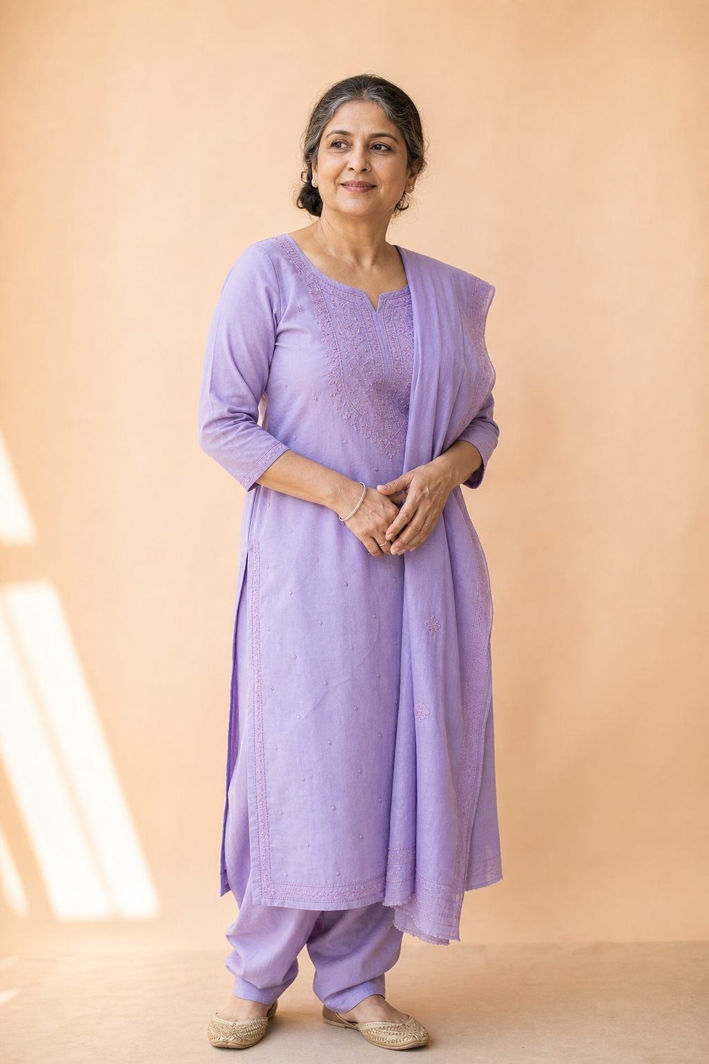 Mature woman in a lavender salwar kameez
