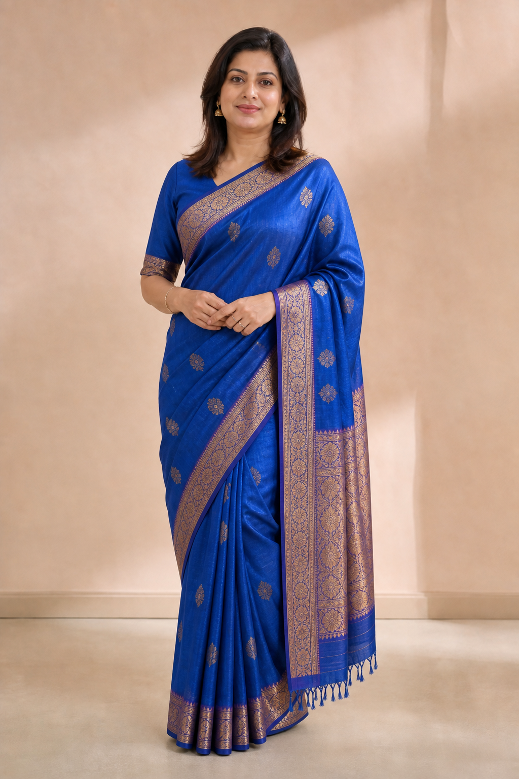 Woman in a royal blue Banarasi saree